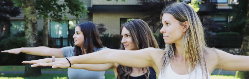 Three people doing yoga